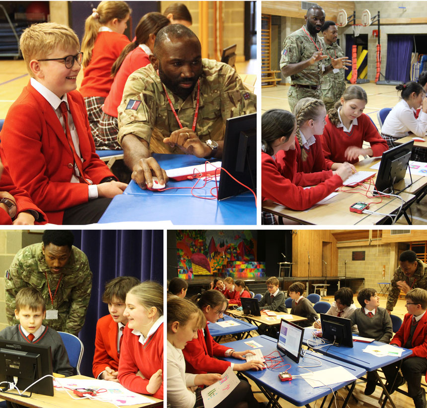 RAF soldiers teaching pupils how to code with python on computers