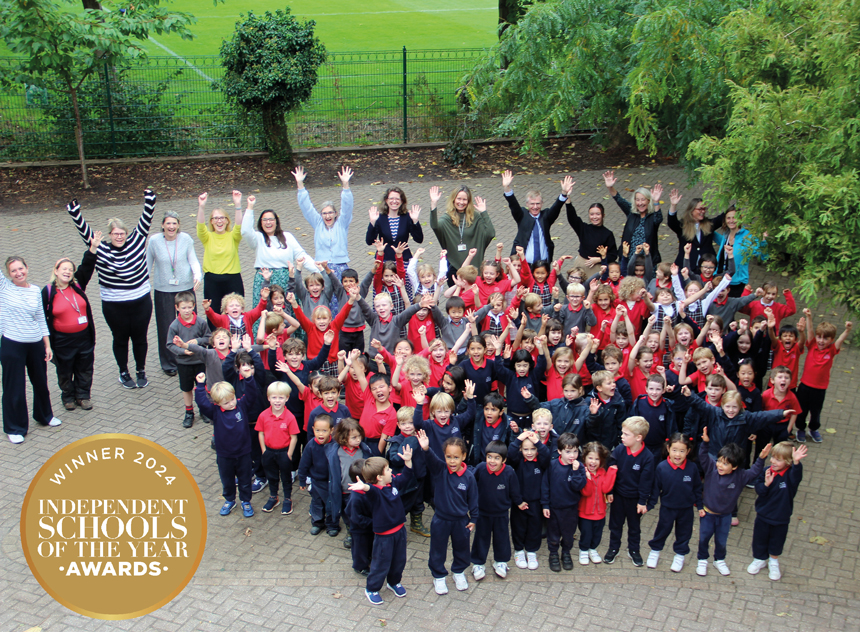 children in the playrgoudn waving hands in the air