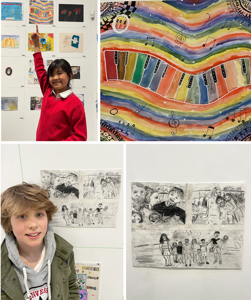 pupils standing next to their artwork at an art exhibition