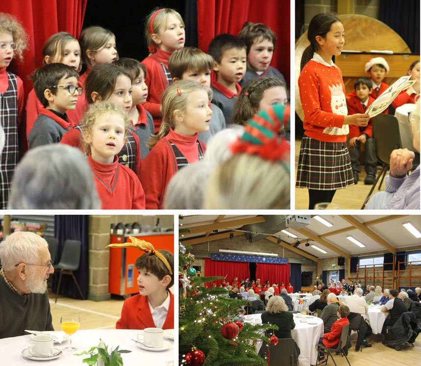 children chatting to senior citizens in a hall for a christmas party