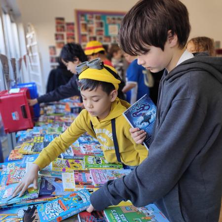 children looking at books