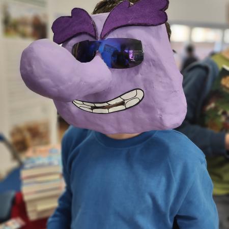 child with purple mask on