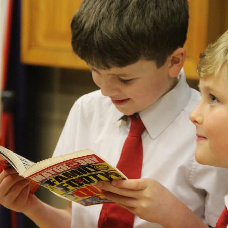 children looking at a book