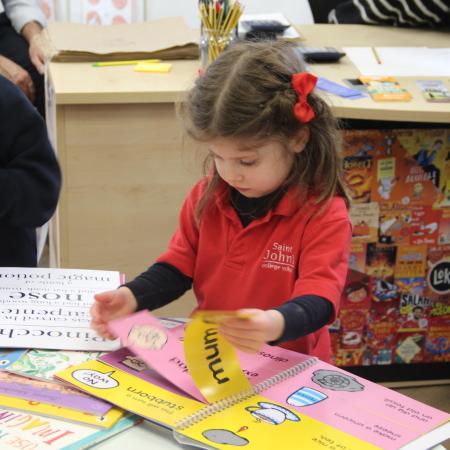 girl looking at a book