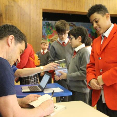 author signing a book for a child