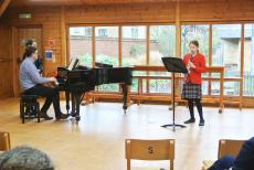 girl playing clarinet in concert