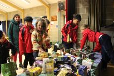 school children gathering donations for harvest festival