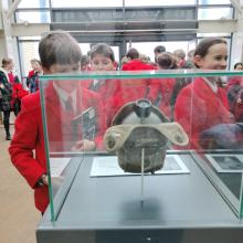 children in an imperial wartime museum looking at artefacts