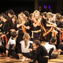 children dressed as Romans acting in a play